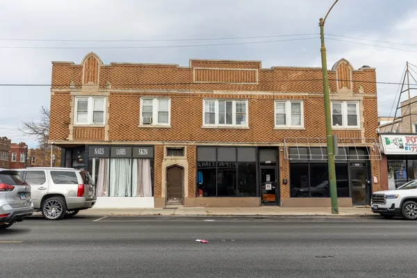a view of a car parked in front of a building