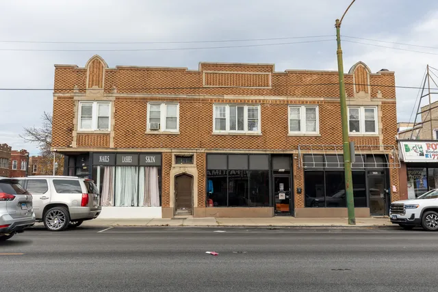 a view of a car parked in front of a building
