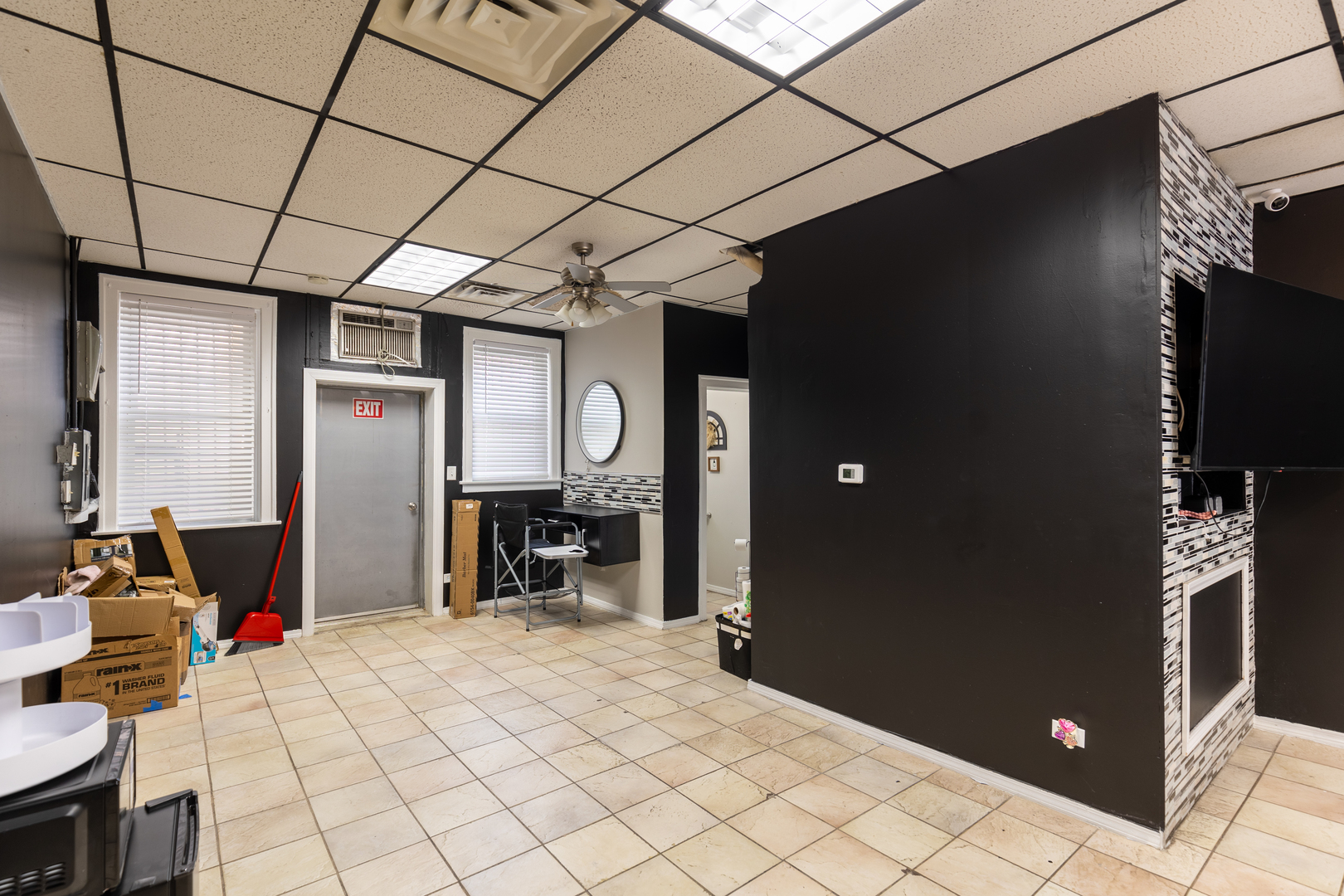 5820-24 West Roosevelt Road Chicago, IL 60644 - Photo 7 of 25 a room with furniture and a flat screen tv