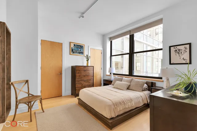 a kitchen with stainless steel appliances kitchen island a stove a sink and a refrigerator