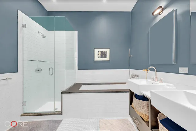 a bedroom with a bed and table chair