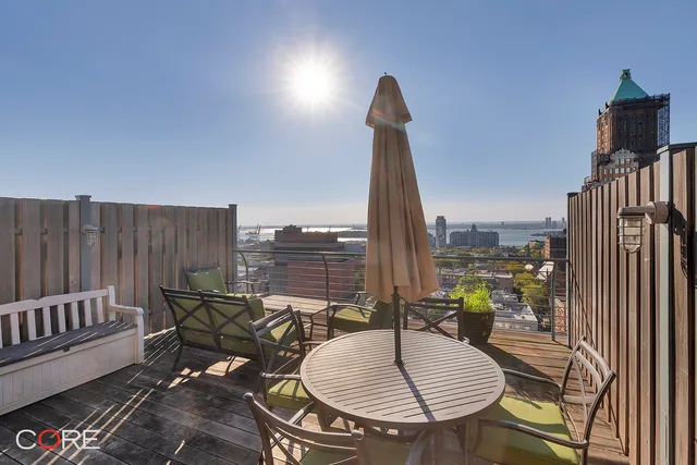 a view of a balcony with furniture