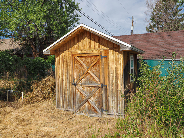 154 East 3000th Street South Bountiful, UT 84010 - Photo 37 of 37 Wood-paneled shed with a gambrel roof and barn-style doors