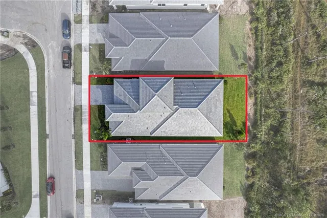 an aerial view of a house with swimming pool