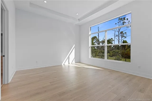 a view of a hardwood floor in a room