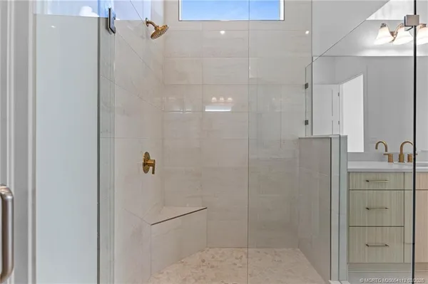 a bathroom with a shower and a sink