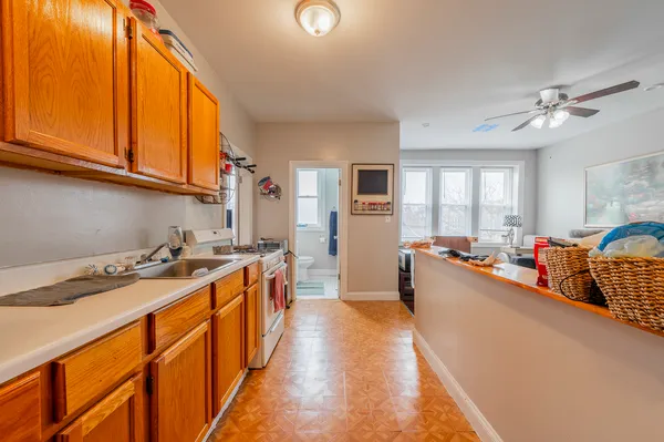 a kitchen that has a lot of cabinets in it