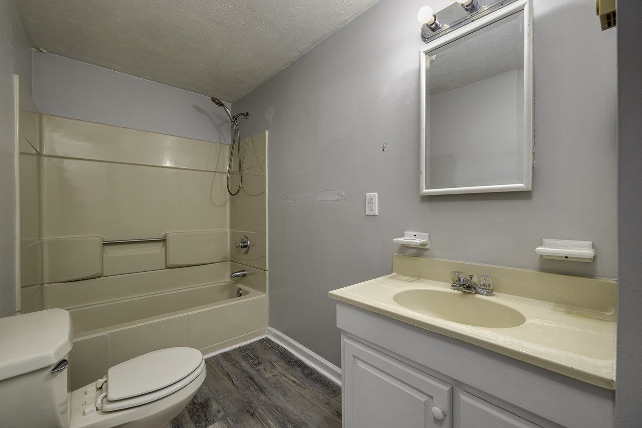 2355 Pine Grove Road Stanley, VA 22851 - Photo 12 of 25 a bathroom with a sink a toilet and shower
