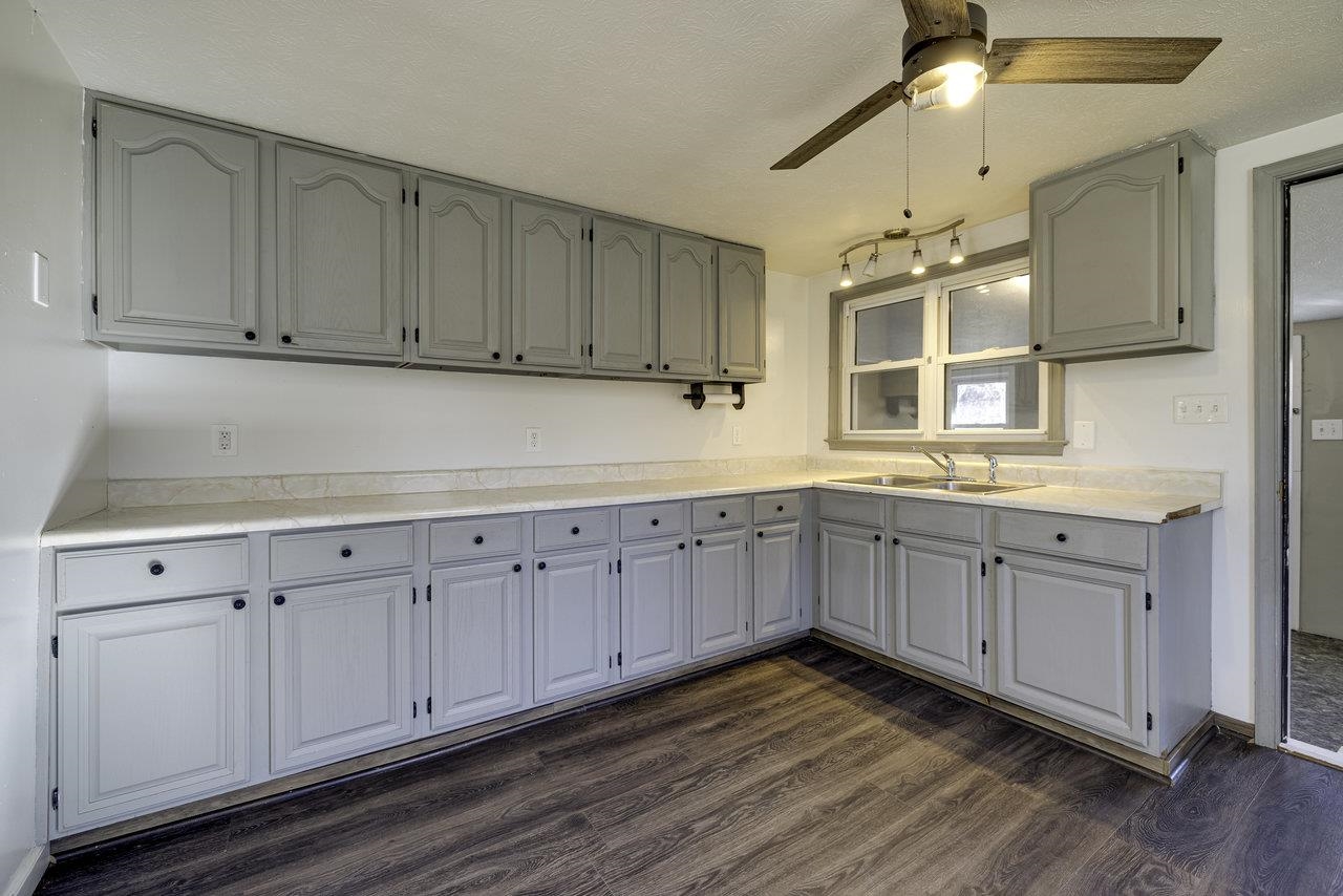 2355 Pine Grove Road Stanley, VA 22851 - Photo 2 of 25 a kitchen with stainless steel appliances granite countertop a sink cabinets and wooden floor