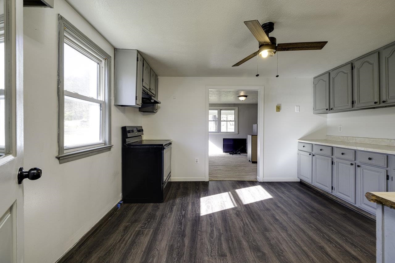 2355 Pine Grove Road Stanley, VA 22851 - Photo 4 of 25 wooden floor in an empty room with a window