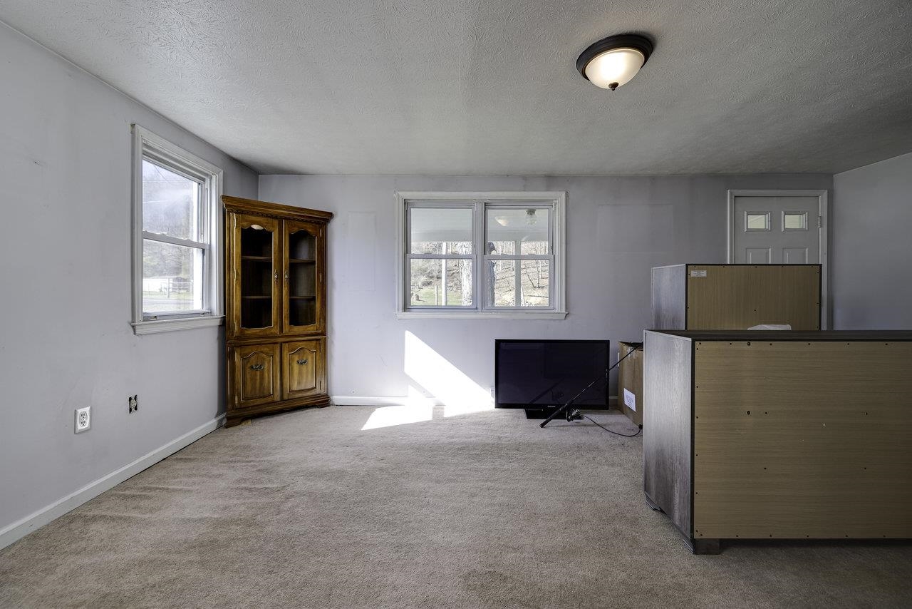 2355 Pine Grove Road Stanley, VA 22851 - Photo 6 of 25 an empty room with windows and cabinet