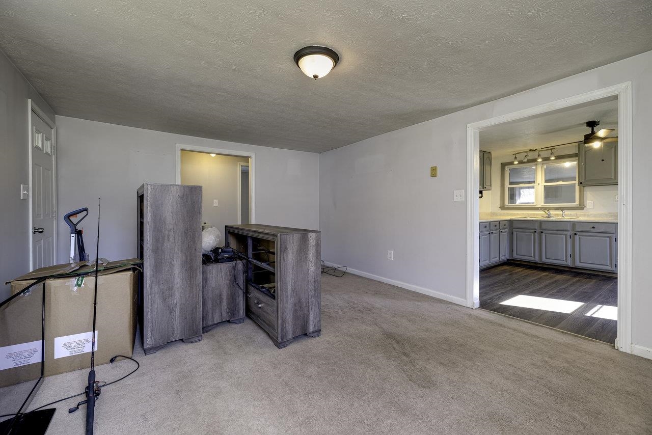 2355 Pine Grove Road Stanley, VA 22851 - Photo 7 of 25 a view of an empty room with window and refrigerator