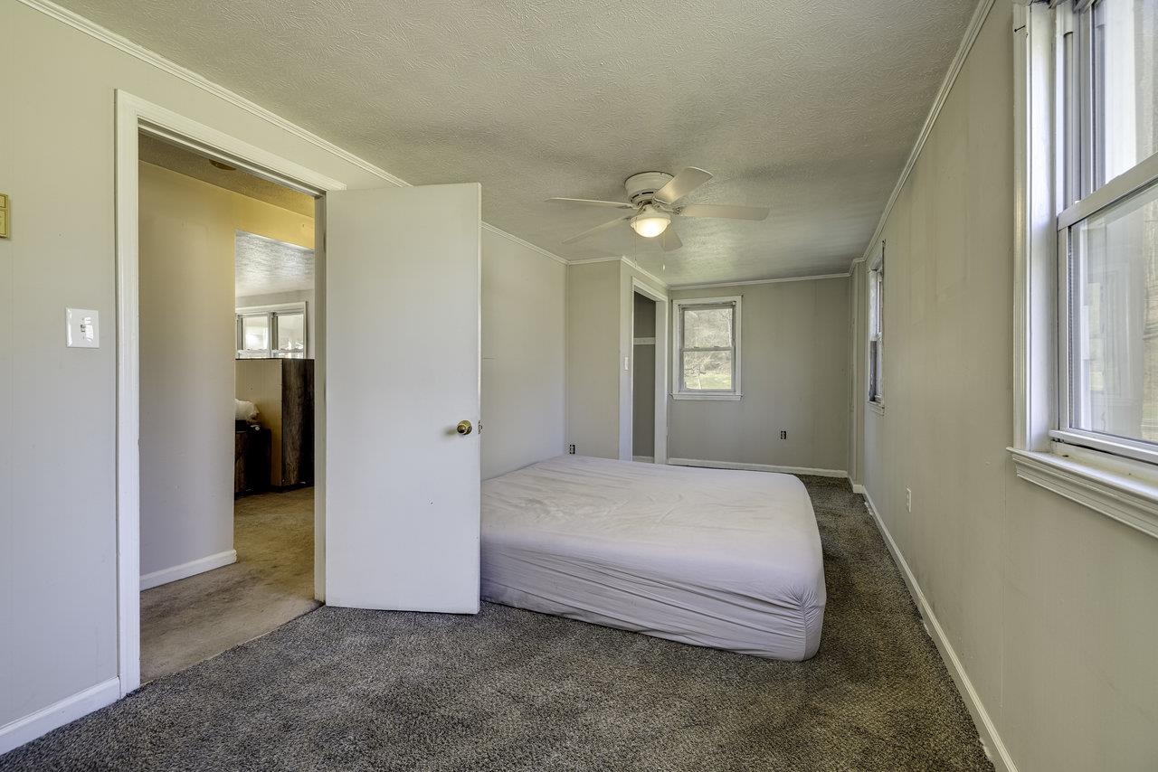 2355 Pine Grove Road Stanley, VA 22851 - Photo 9 of 25 a spacious bedroom with a bed and closet