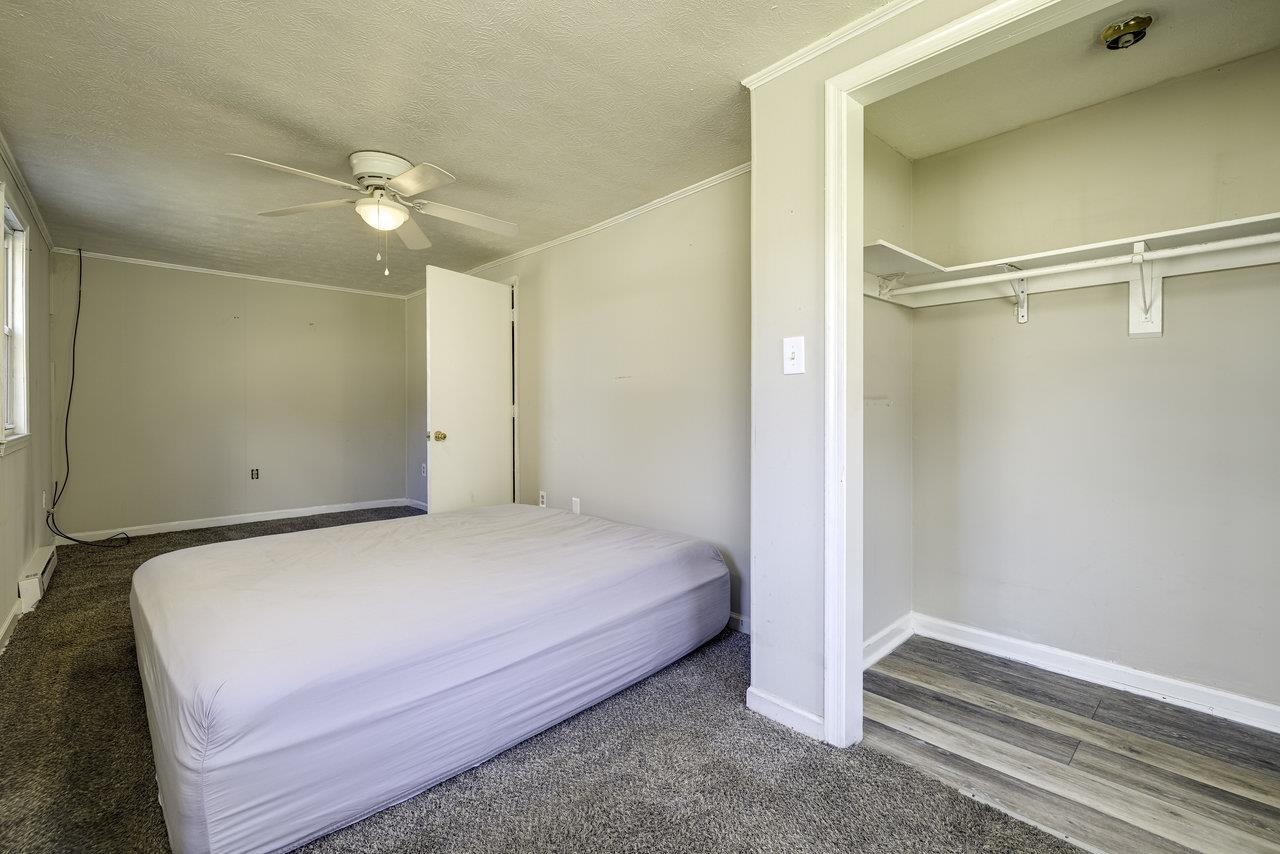 2355 Pine Grove Road Stanley, VA 22851 - Photo 10 of 25 a bedroom with a bed and a ceiling fan