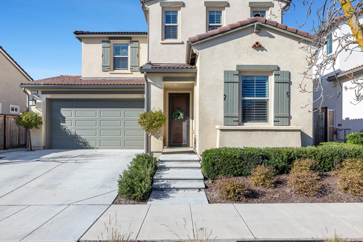 4286 Oak Knoll Road Madera, CA 93636 - Photo 12 of 43 a front view of a house with garden