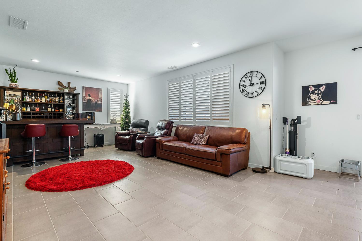 4286 Oak Knoll Road Madera, CA 93636 - Photo 19 of 43 a living room with furniture a rug and white walls
