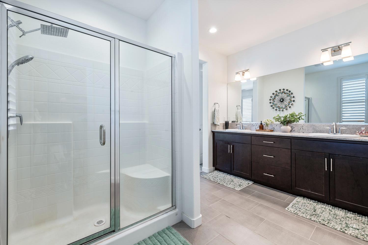 4286 Oak Knoll Road Madera, CA 93636 - Photo 38 of 43 a bathroom with a double vanity sink mirror and shower