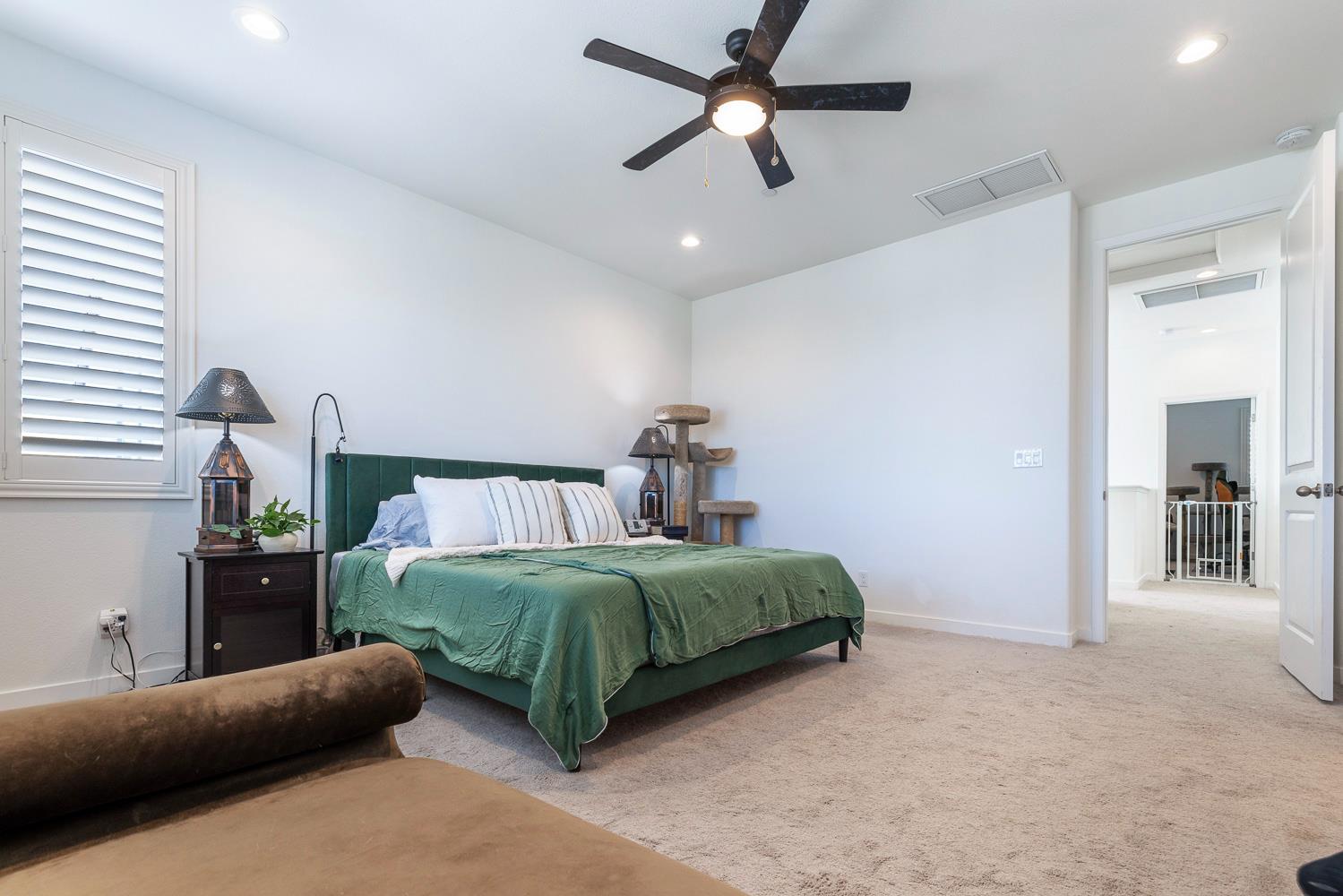 4286 Oak Knoll Road Madera, CA 93636 - Photo 10 of 43 a living room with a bed furniture and a large window