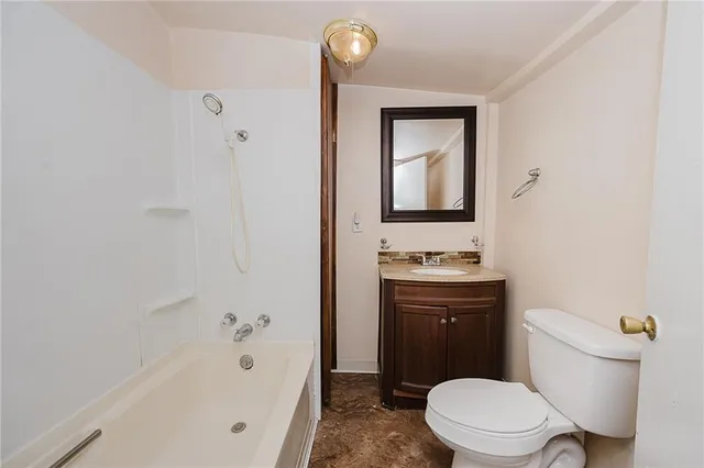 a bathroom with a sink a toilet and a bathtub