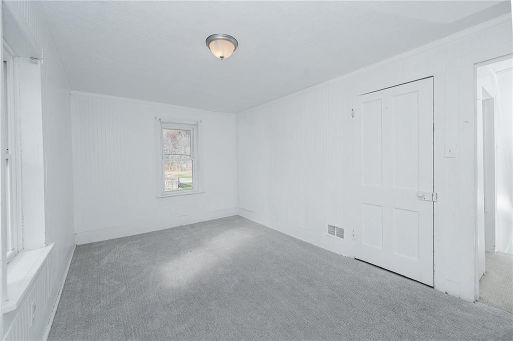 349 Adams Street Clymer, PA 15728 - Photo 35 of 36 an empty room with a empty space and windows