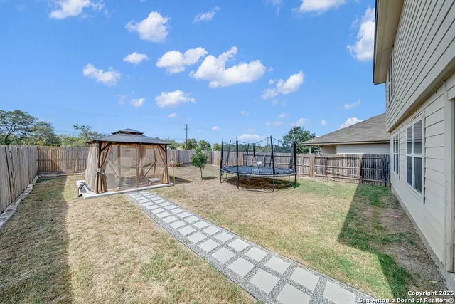 a view of a backyard with a patio