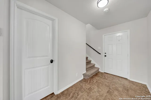 a view of entryway with stairs