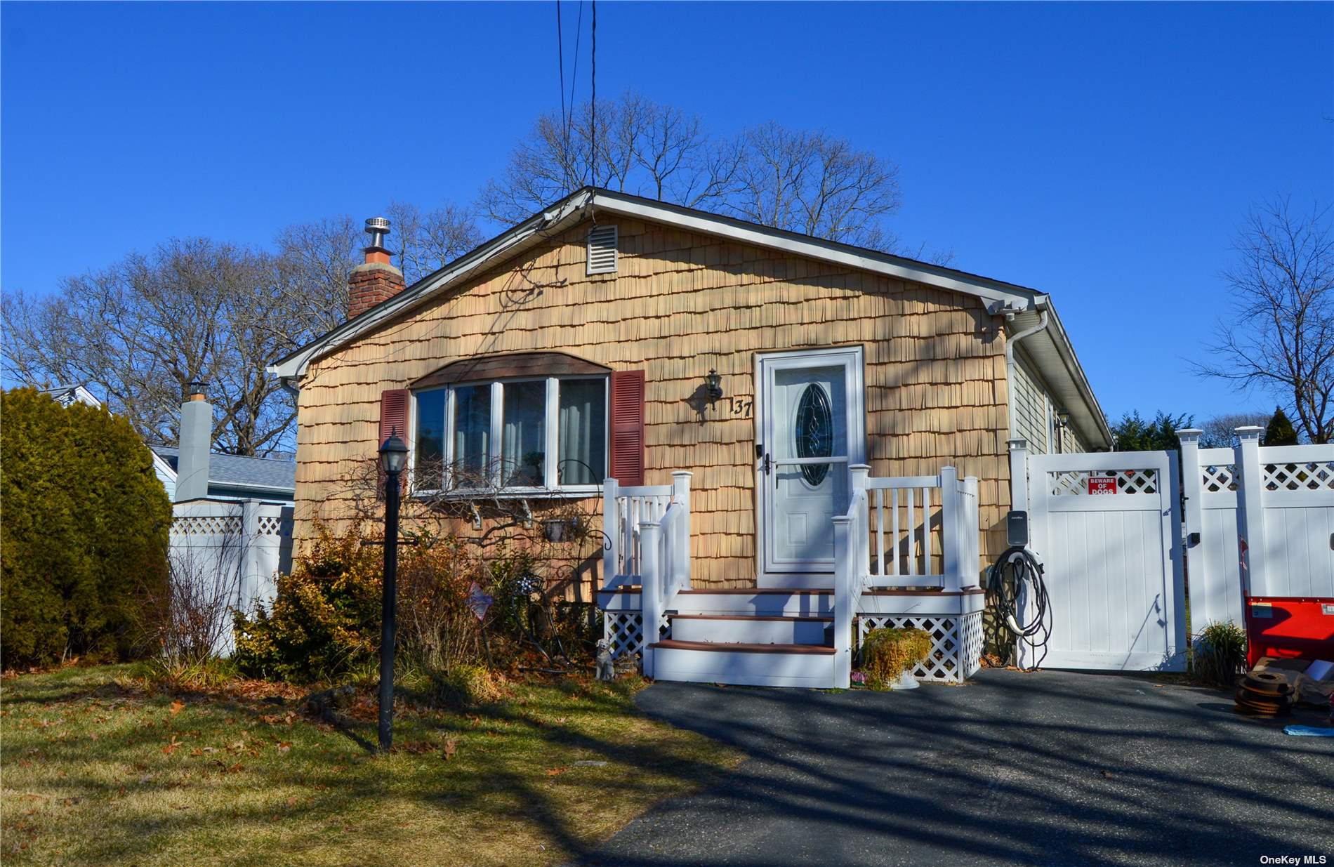 137 Blue Point Road Selden, NY 11784 - Photo 1 of 1 a front view of a house with sitting area