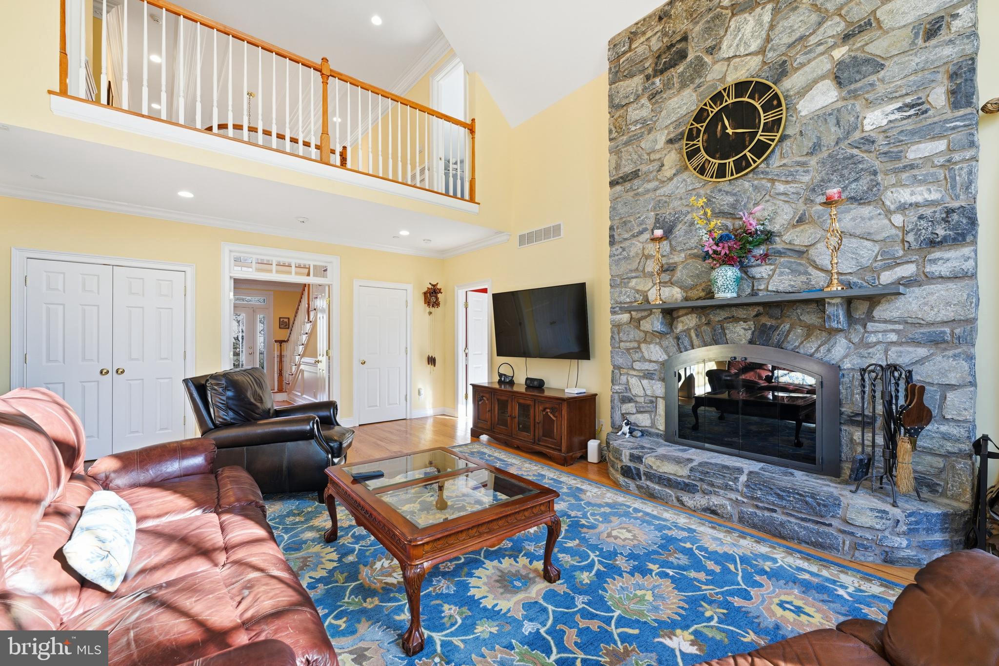 171 Firecreek Road Newtown, PA 18940 - Photo 14 of 54 a living room with furniture a flat screen tv and a fireplace