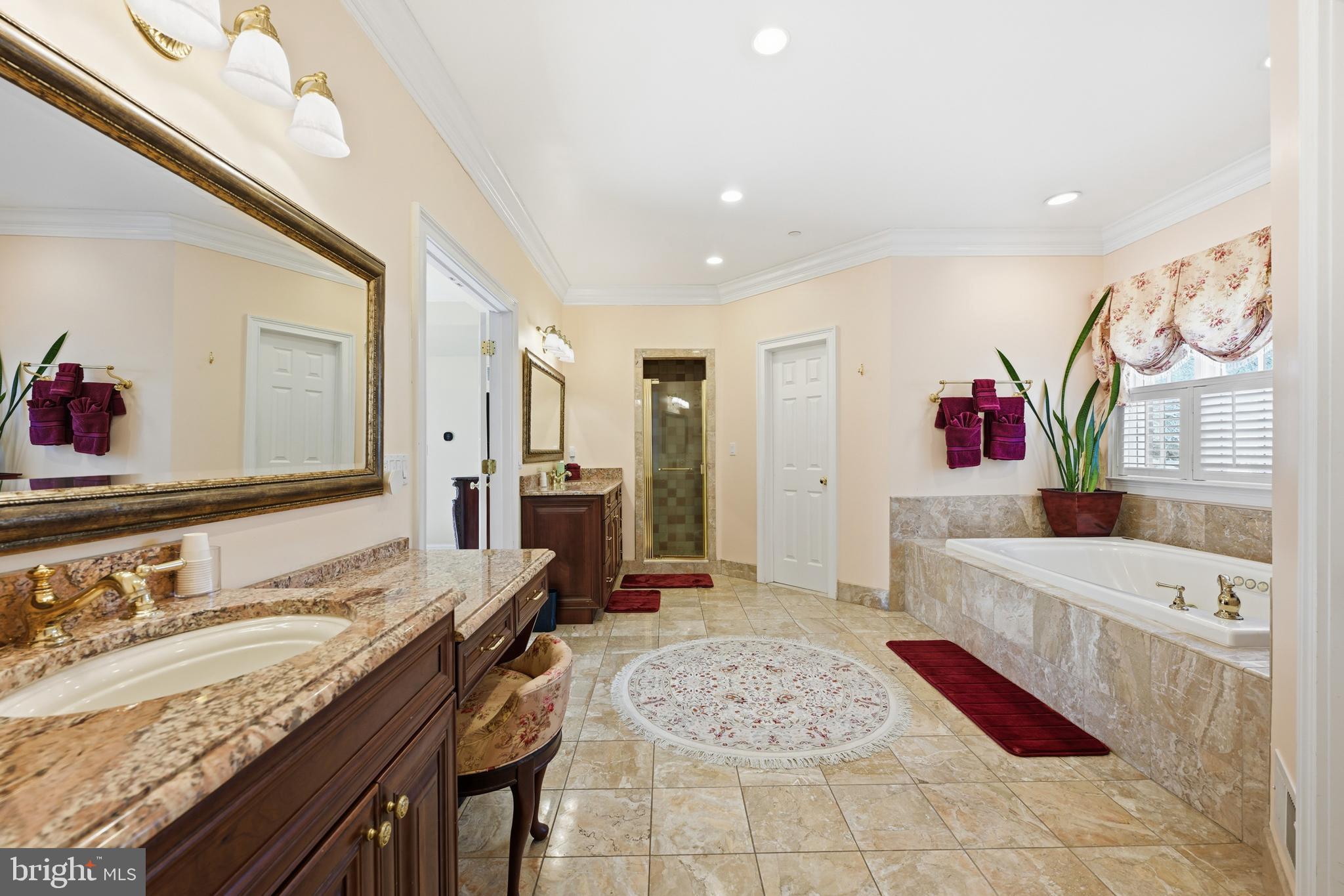 171 Firecreek Road Newtown, PA 18940 - Photo 29 of 54 a spacious bathroom with a granite countertop tub sink and mirror