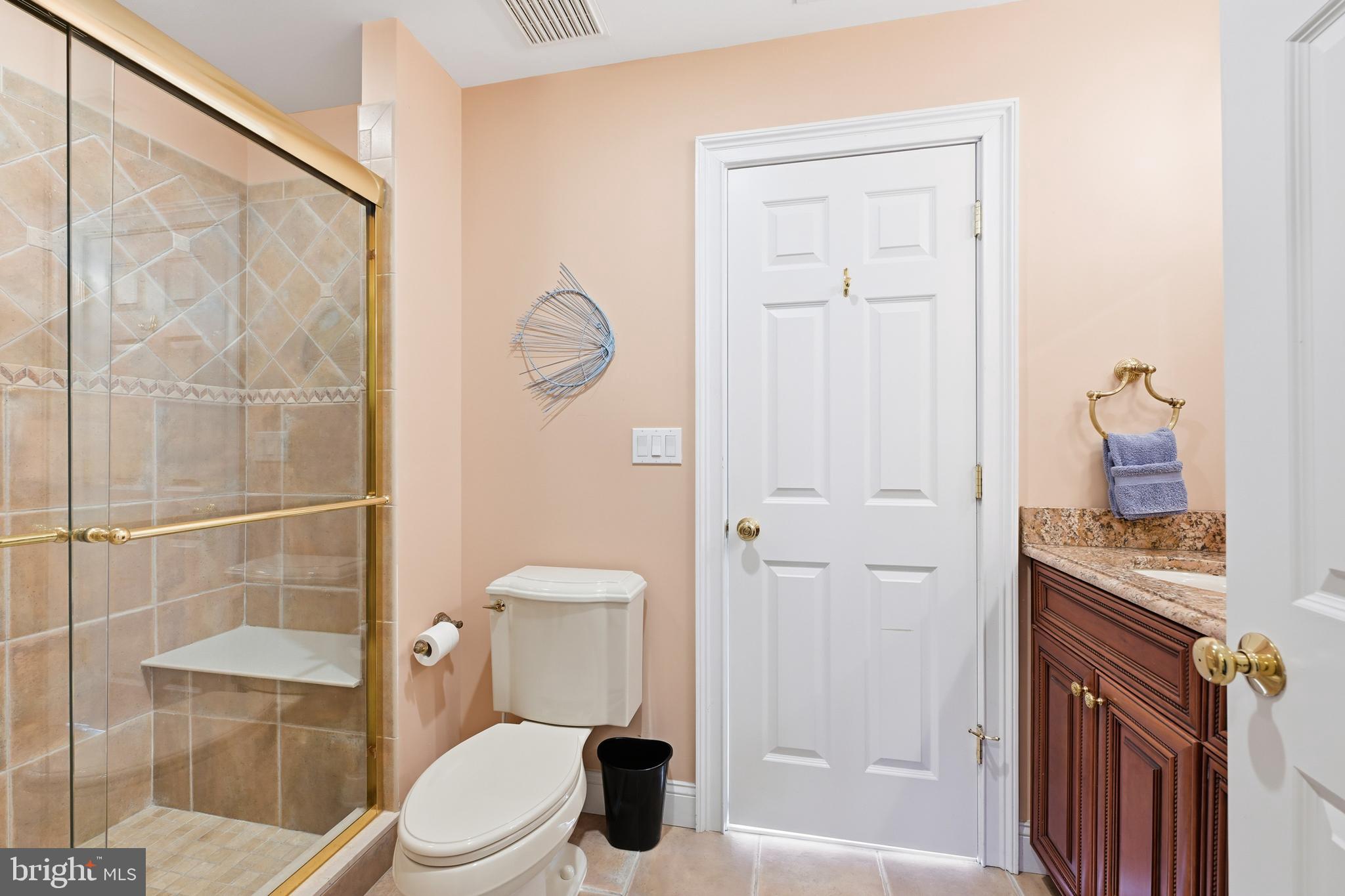 171 Firecreek Road Newtown, PA 18940 - Photo 42 of 54 a white toilet sitting next to a bathroom sink