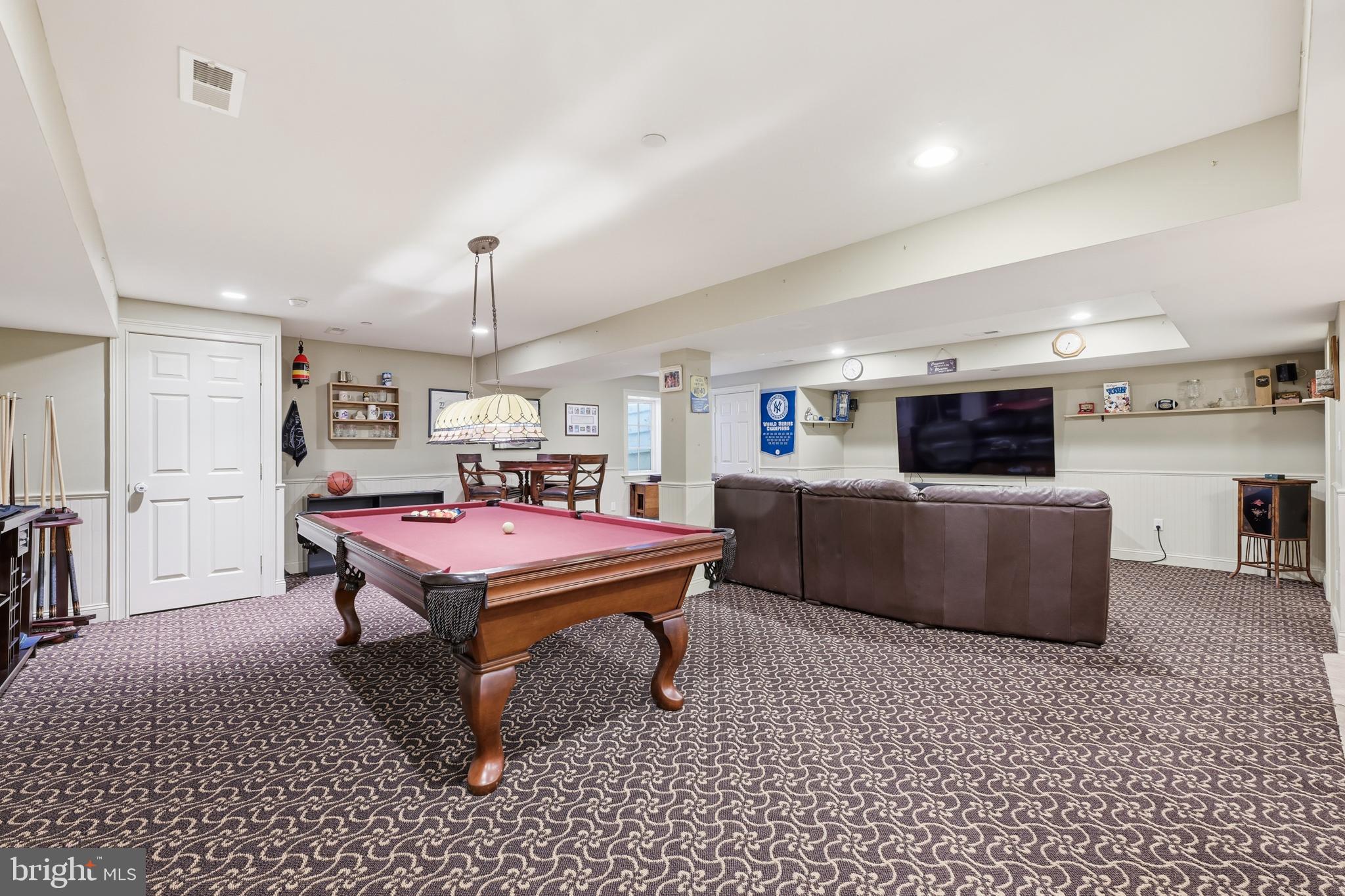 171 Firecreek Road Newtown, PA 18940 - Photo 46 of 54 a living room with furniture a flat screen tv and a table