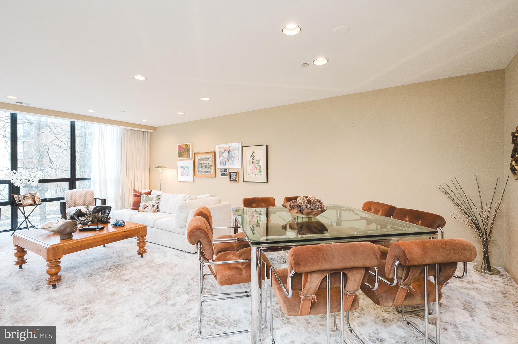 4001 Old Court Road, Unit 218 Baltimore, MD 21208 - Photo 11 of 44 a living room with furniture and a large window