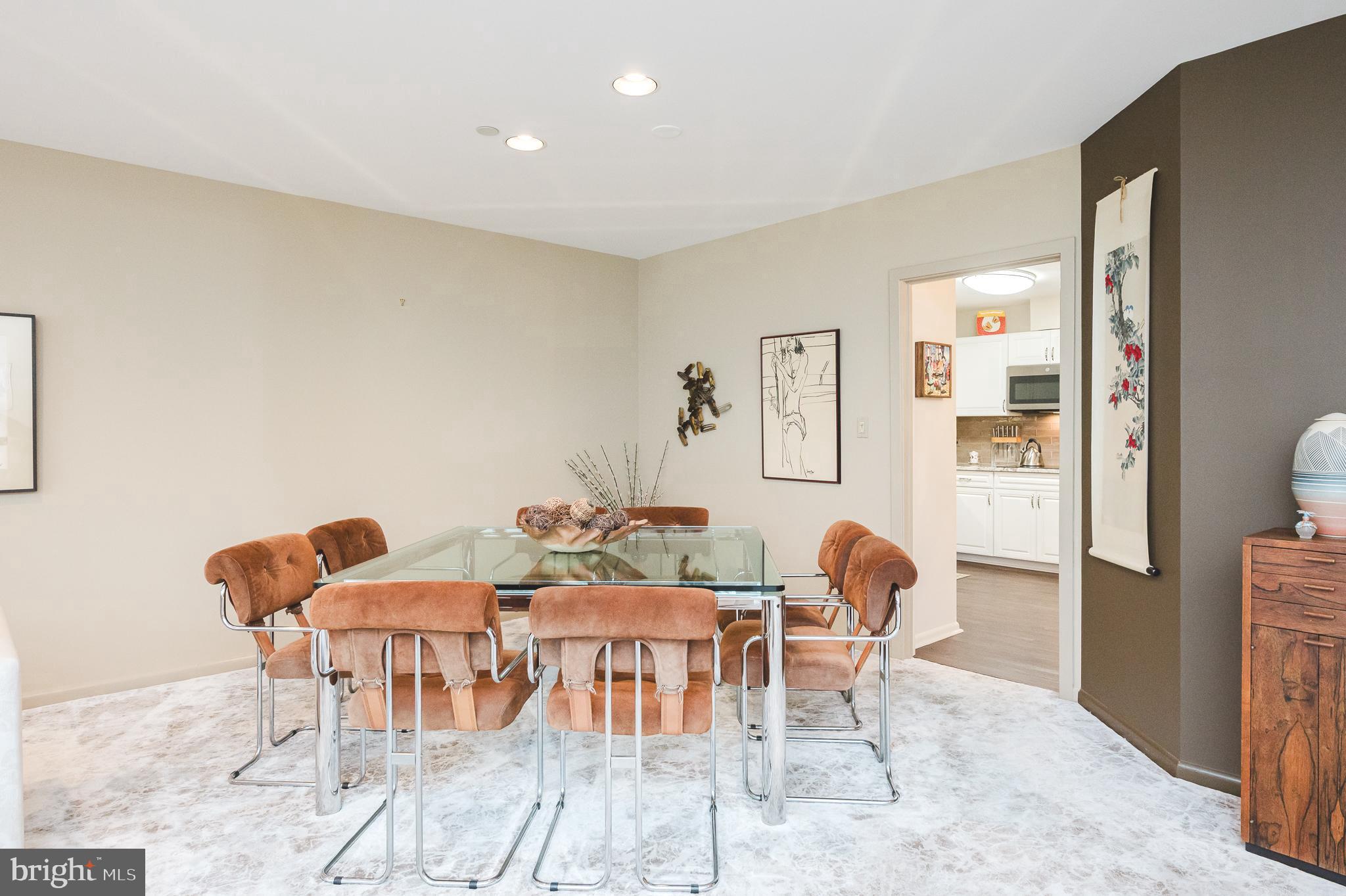 4001 Old Court Road, Unit 218 Baltimore, MD 21208 - Photo 12 of 44 a dining room with furniture and wooden floor