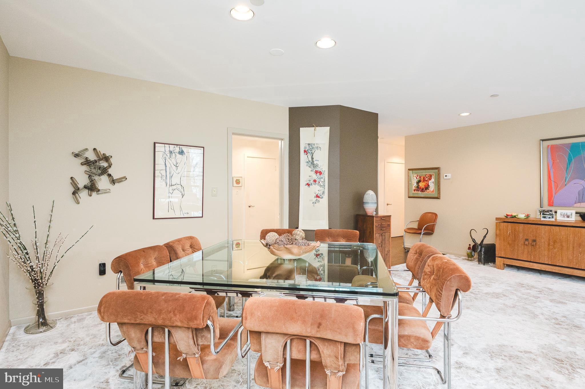 4001 Old Court Road, Unit 218 Baltimore, MD 21208 - Photo 13 of 44 a dining room with furniture and wooden floor