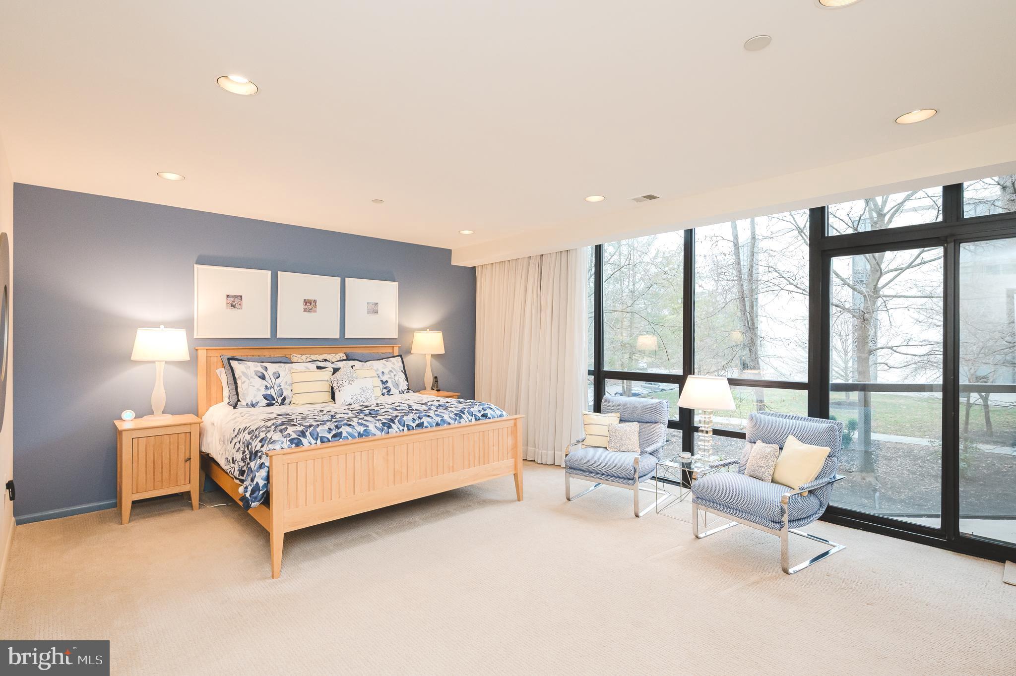 4001 Old Court Road, Unit 218 Baltimore, MD 21208 - Photo 14 of 44 a bed room with a bed and large window