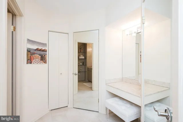 a bathroom with a shower sink and mirror