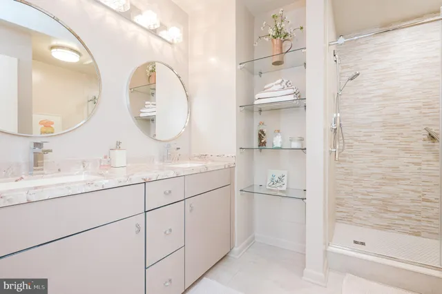 a bathroom with a granite countertop sink a toilet and a mirror