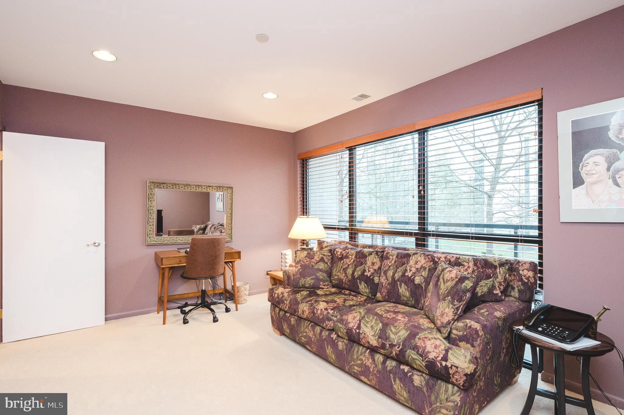 4001 Old Court Road, Unit 218 Baltimore, MD 21208 - Photo 22 of 44 a living room with furniture and a flat screen tv