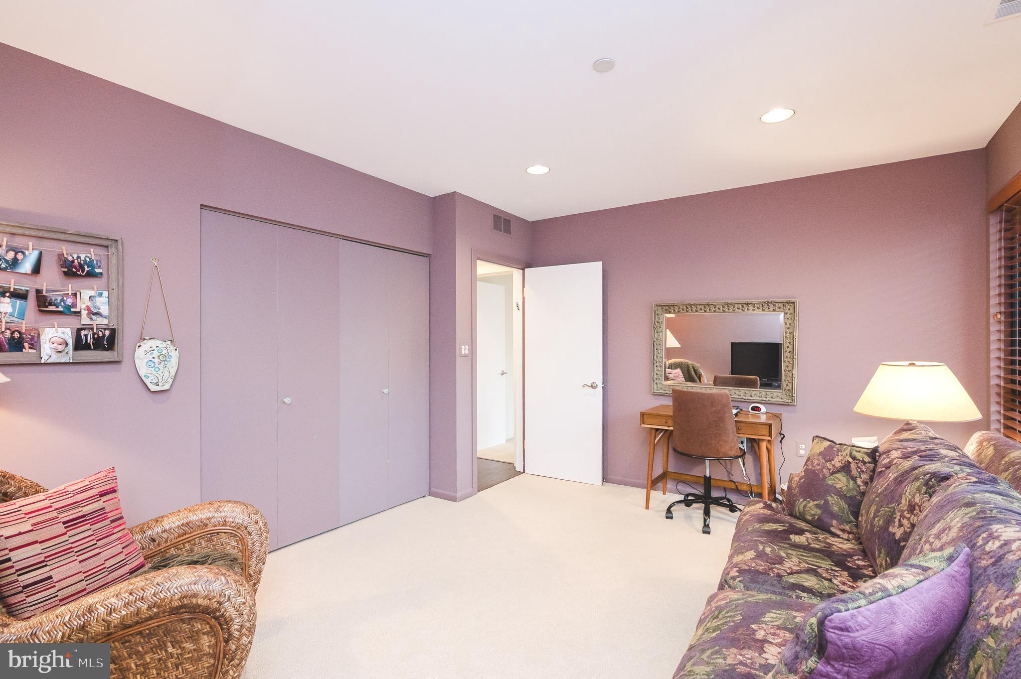 4001 Old Court Road, Unit 218 Baltimore, MD 21208 - Photo 23 of 44 a bed room with a bed and a chair