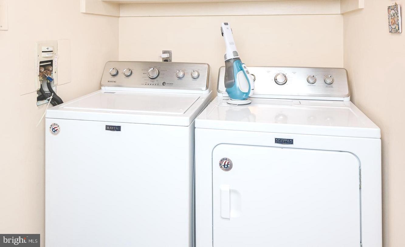 4001 Old Court Road, Unit 218 Baltimore, MD 21208 - Photo 25 of 44 a utility room with dryer and washer