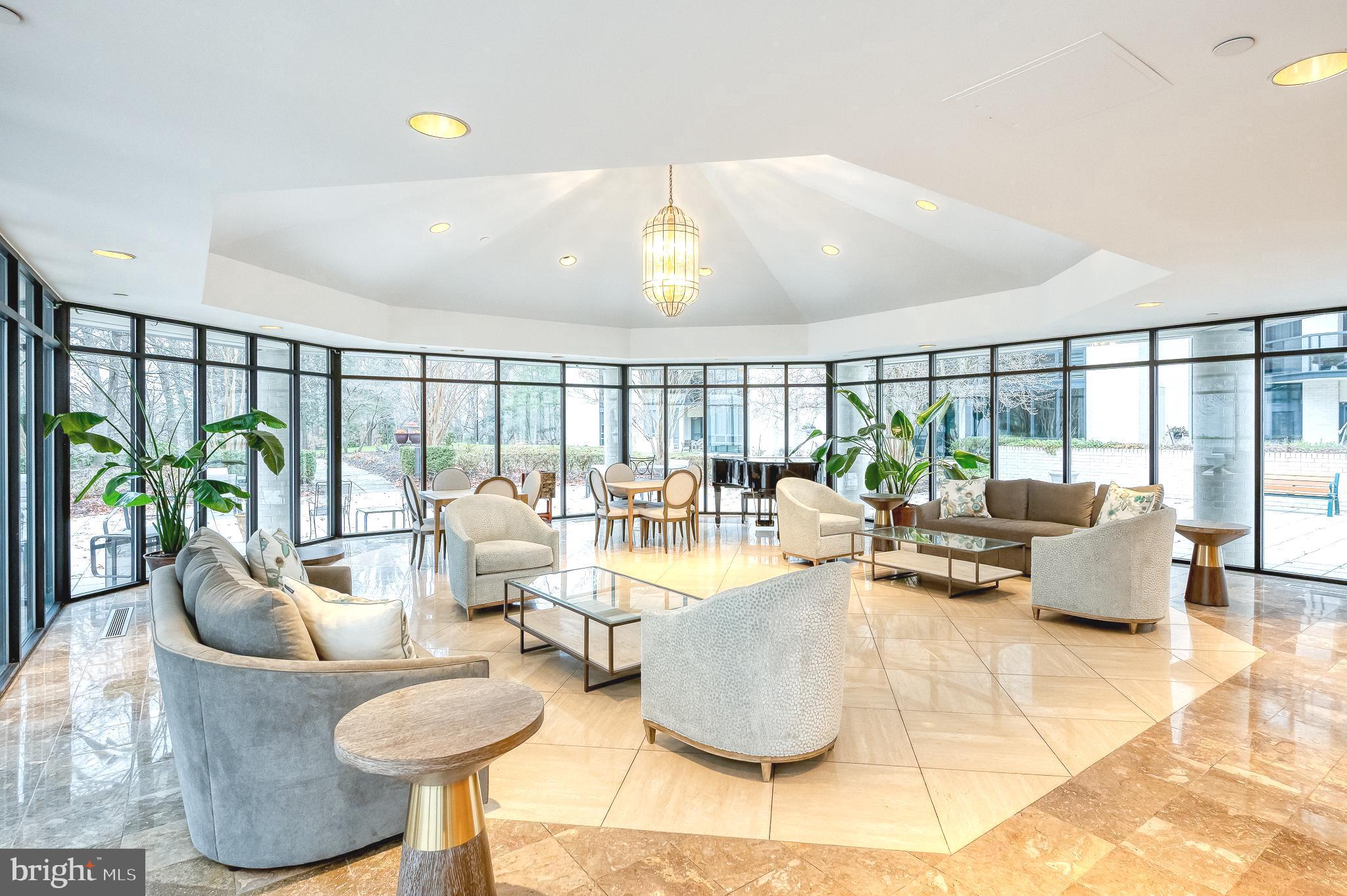4001 Old Court Road, Unit 218 Baltimore, MD 21208 - Photo 31 of 44 a living room with fireplace furniture and a large window