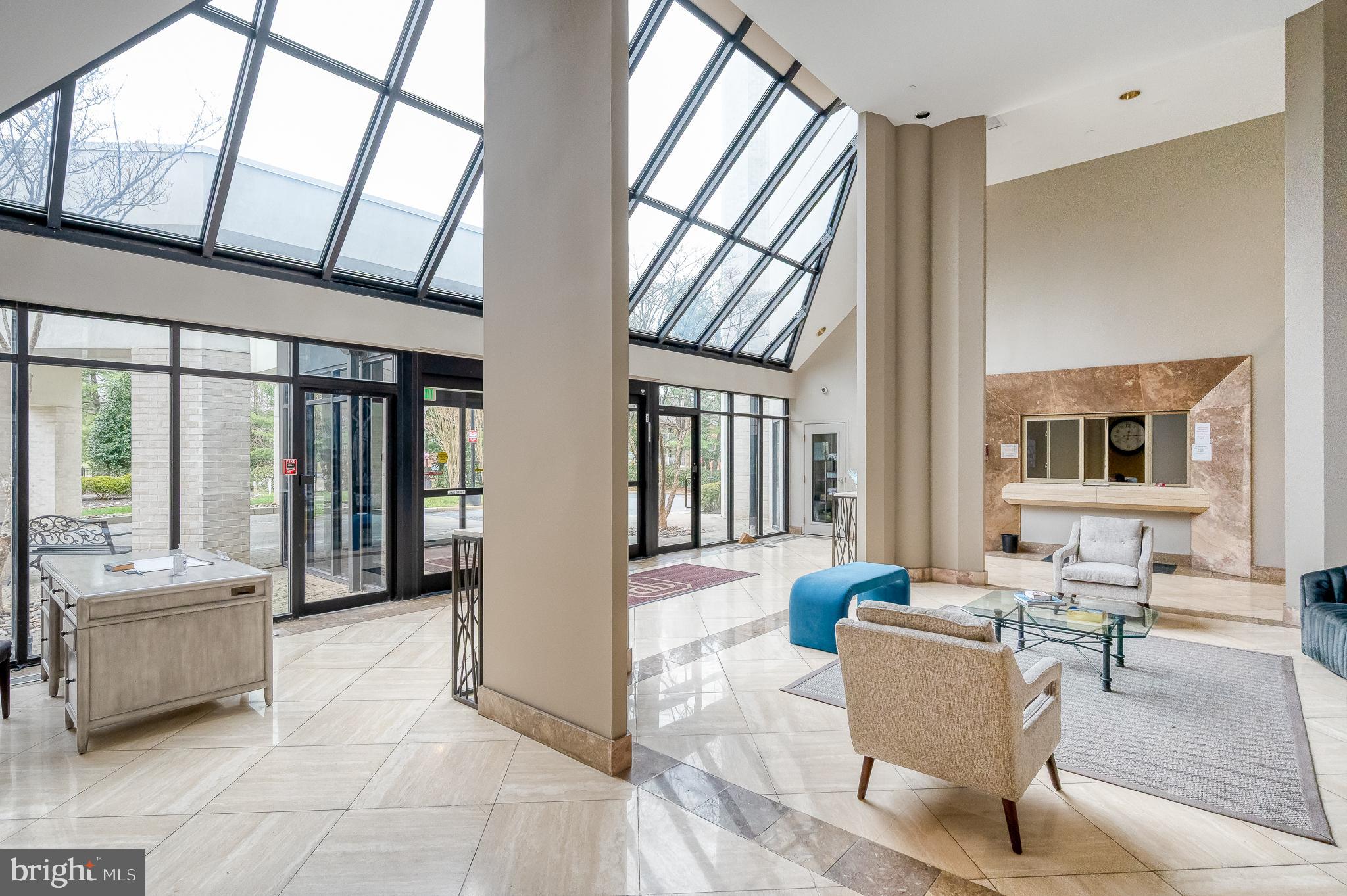 4001 Old Court Road, Unit 218 Baltimore, MD 21208 - Photo 41 of 44 a living room with furniture and a large window
