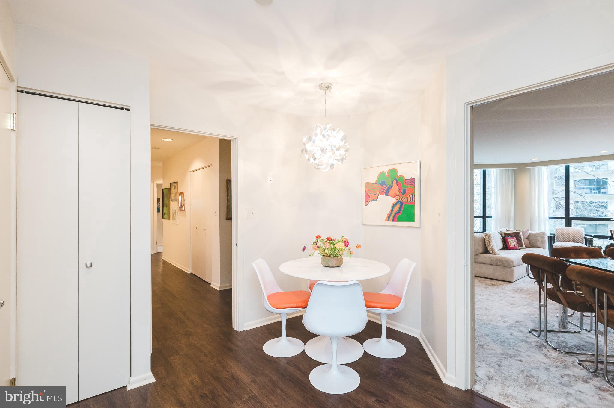 4001 Old Court Road, Unit 218 Baltimore, MD 21208 - Photo 5 of 44 a view of a dining room with furniture and wooden floor