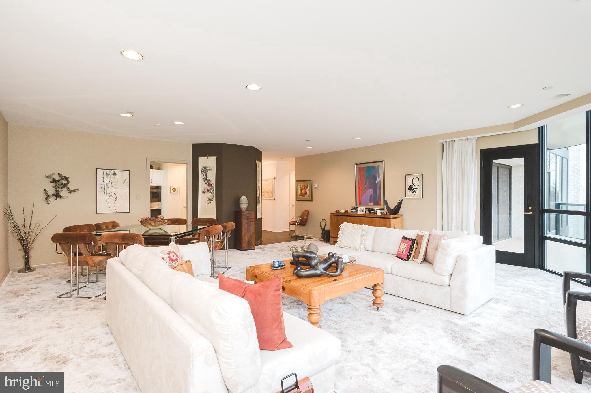 4001 Old Court Road, Unit 218 Baltimore, MD 21208 - Photo 9 of 44 a living room with furniture and a large window