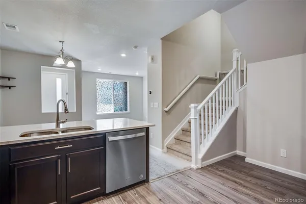 a kitchen with a sink and a window
