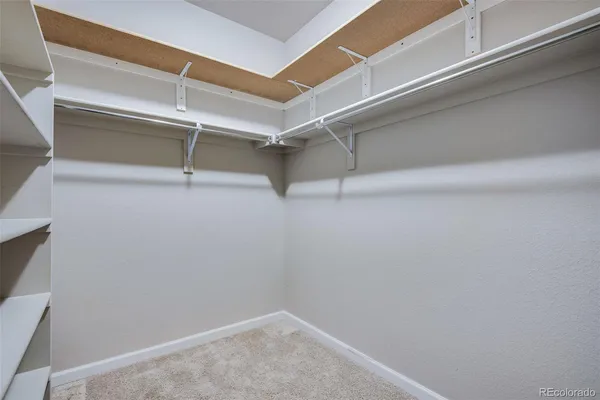 a view of an empty walk in closet