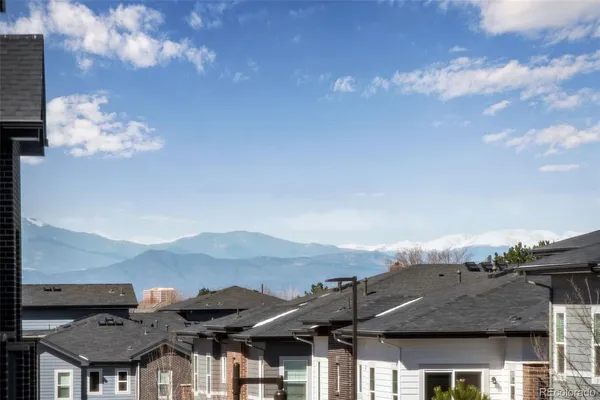 a view of a house with a mountain in the background