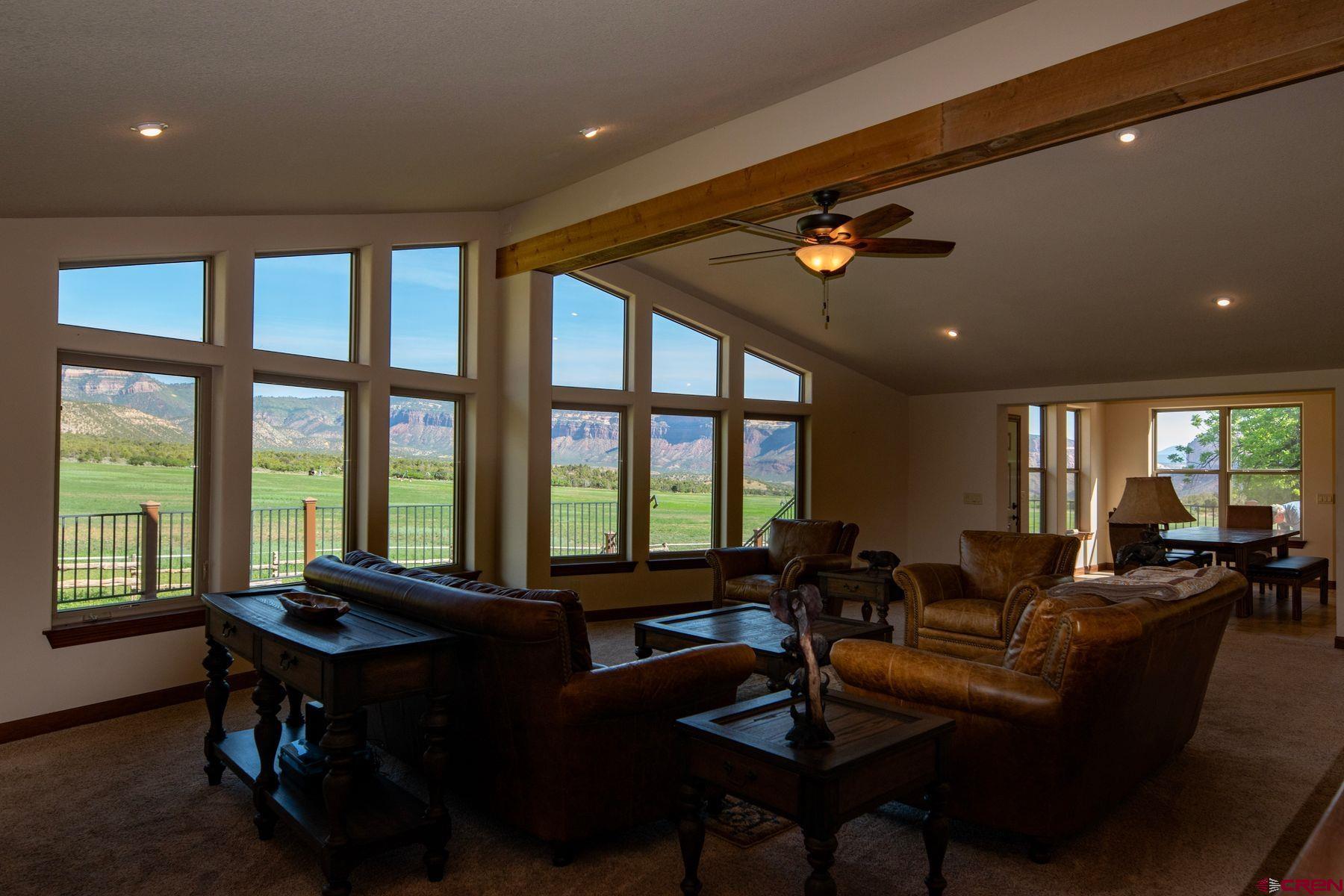 Undisclosed Address Gateway, CO 81522 - Photo 13 of 45 a living room with furniture and floor to ceiling windows