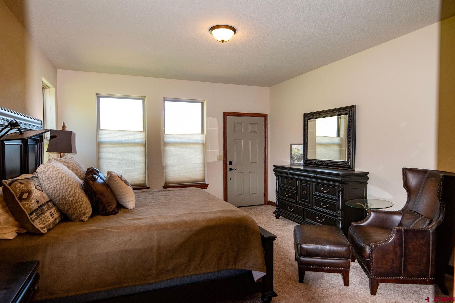 Undisclosed Address Gateway, CO 81522 - Photo 17 of 45 a bedroom with a bed and wooden floor