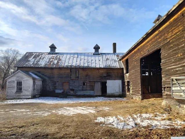 a view of a house with a yard and garage